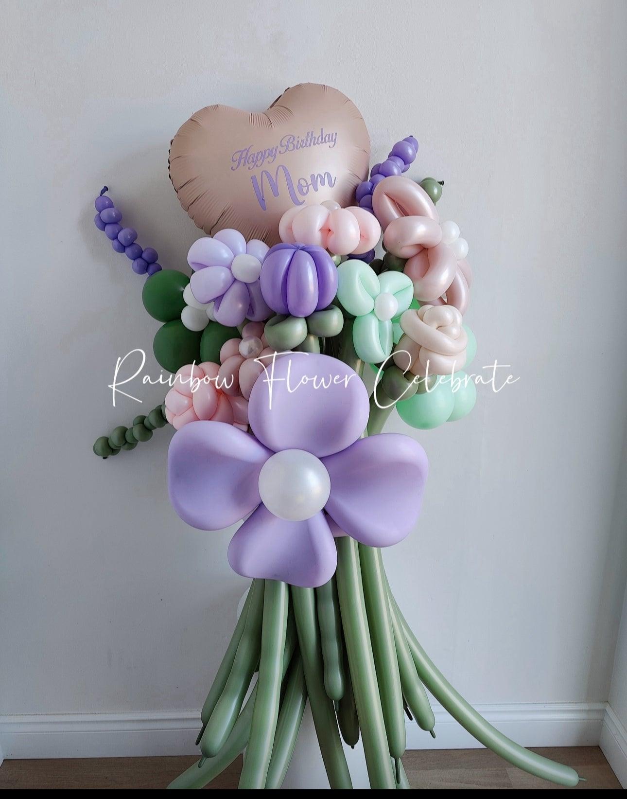 Balloon flower bouquet with heart-shaped 'Happy Birthday Mom' balloon in pastel colors