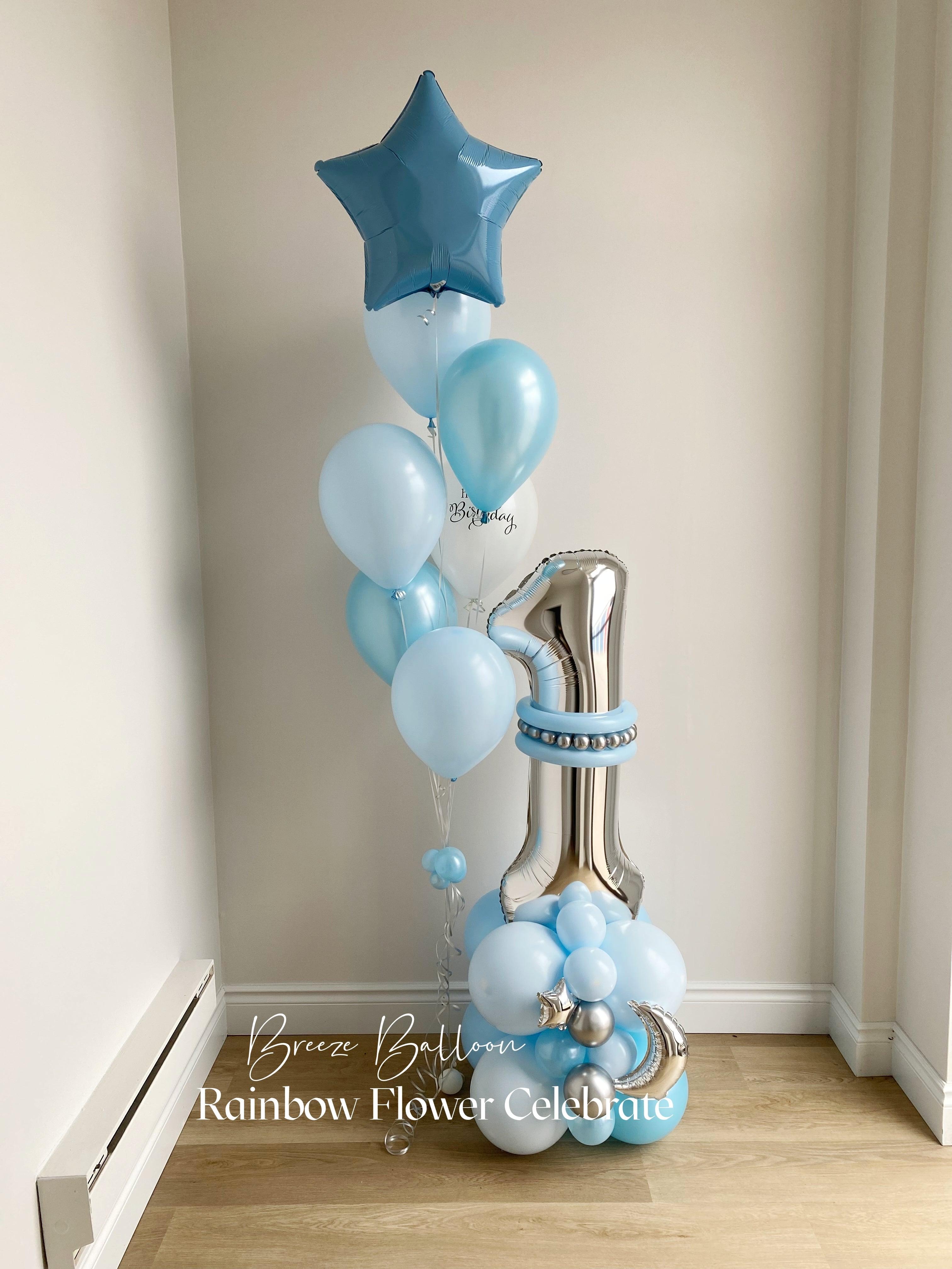 Blue and silver balloon bouquet with star and number one balloons, set for a birthday celebration and anniversary