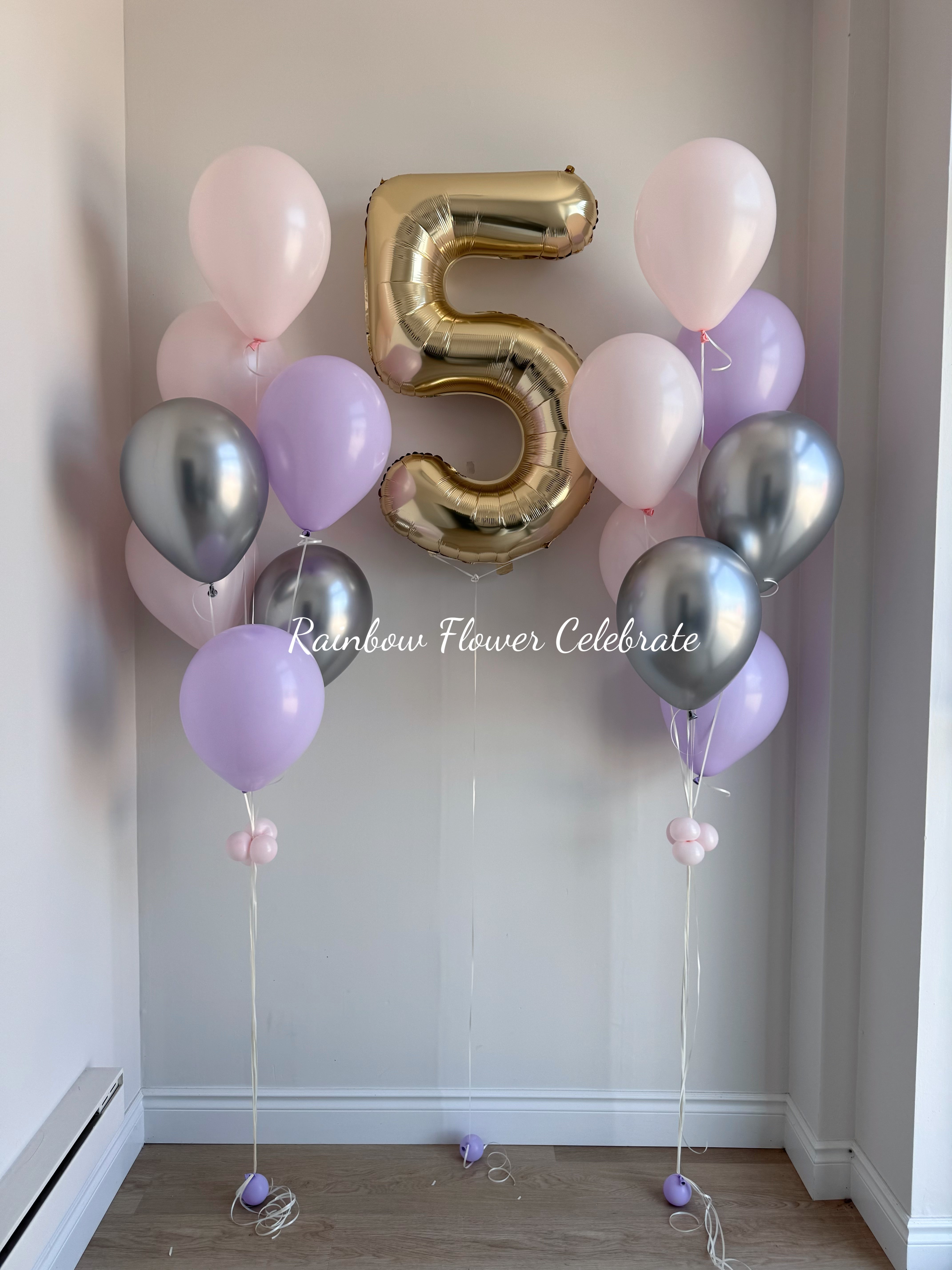 Helium Balloon arrangement with a gold number 5 balloon and pastel pink and purple balloons for home and party room setup
