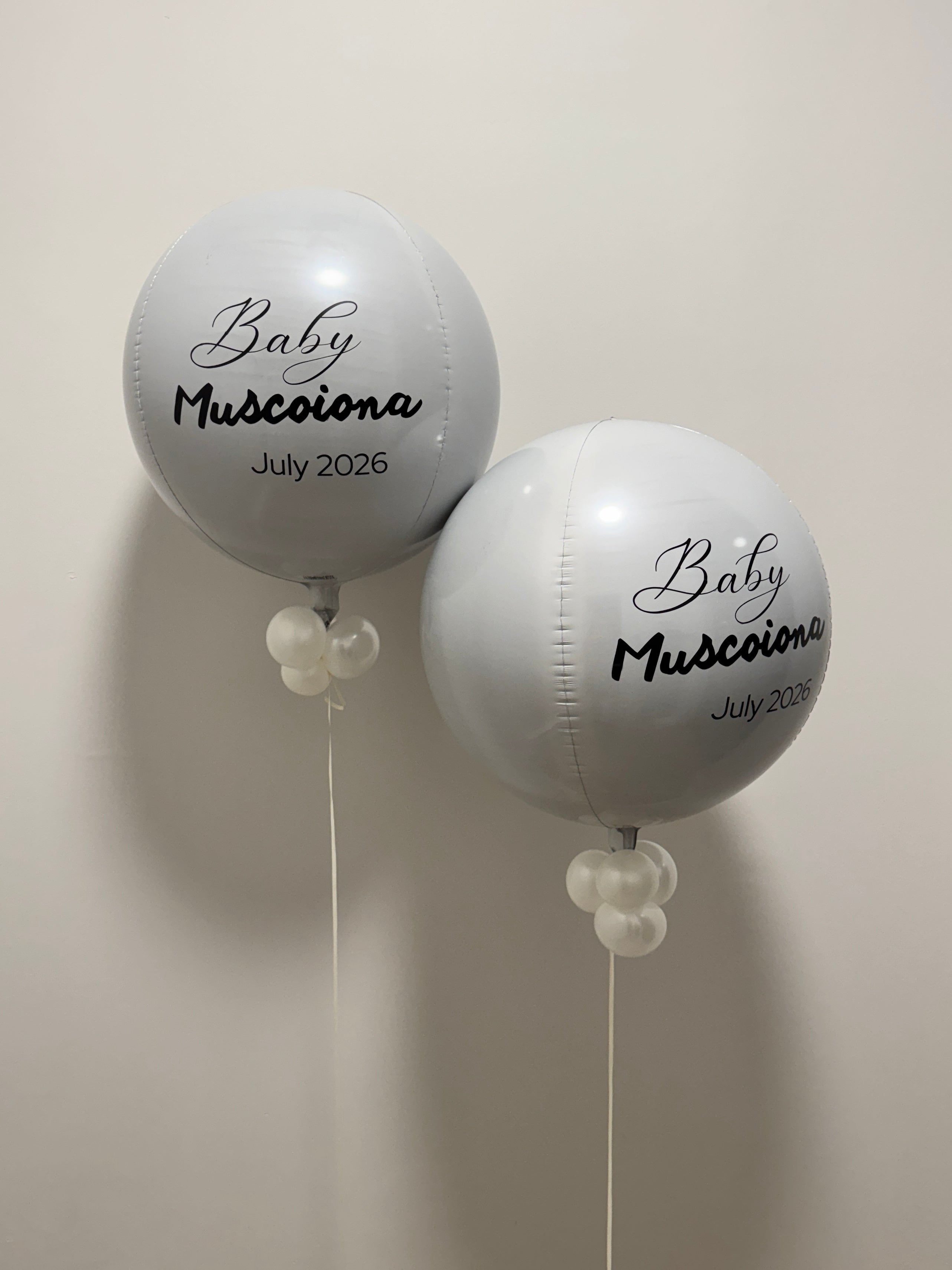 white helium orbz balloons with personalized text on balloon
