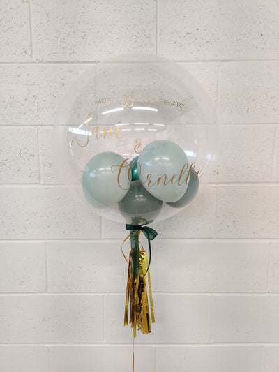 20-22 Inches Clear BoBo balloon with mini stuffed balloons and personalized Message