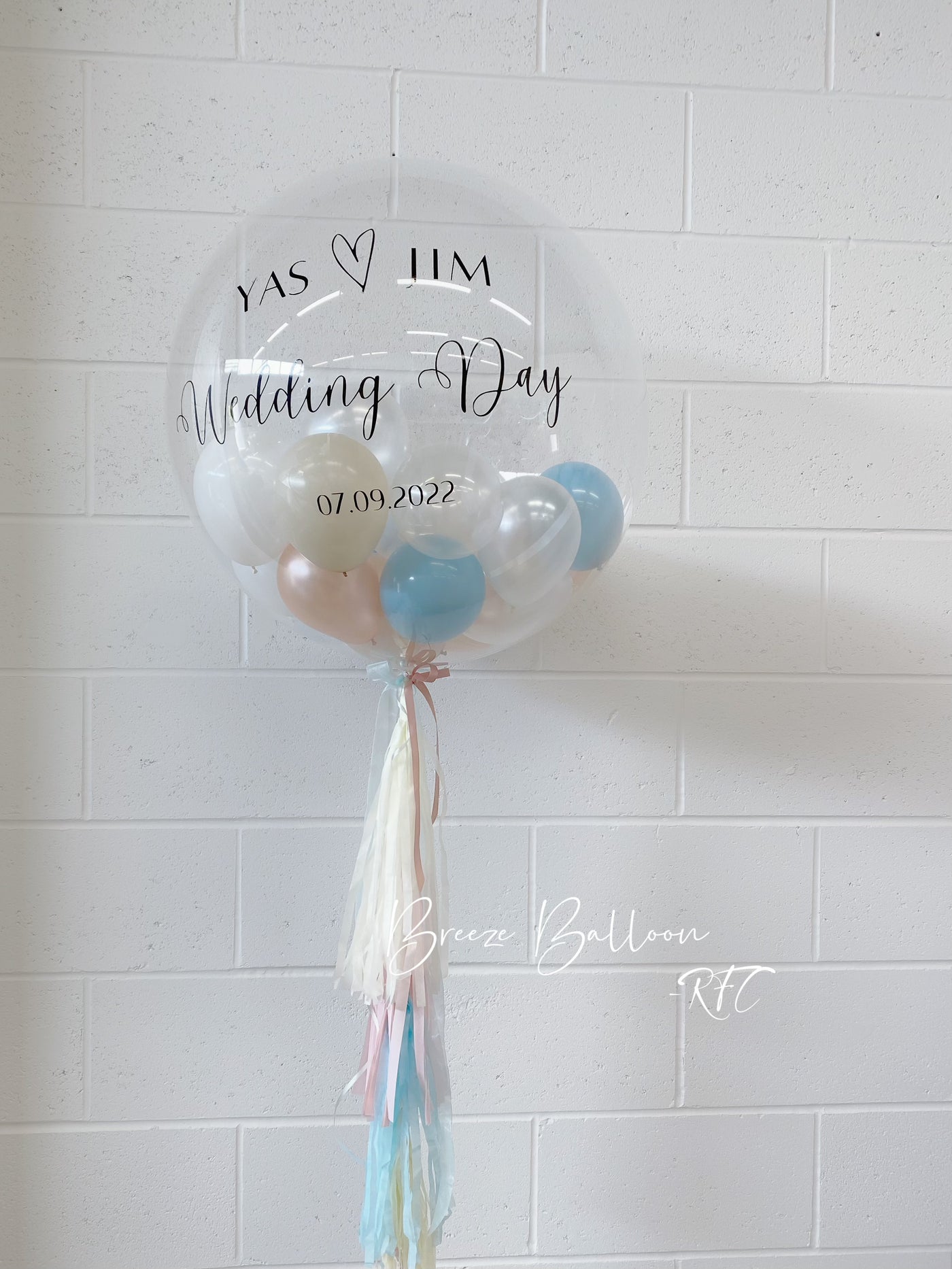 Large personalized Bobo balloon with tassel